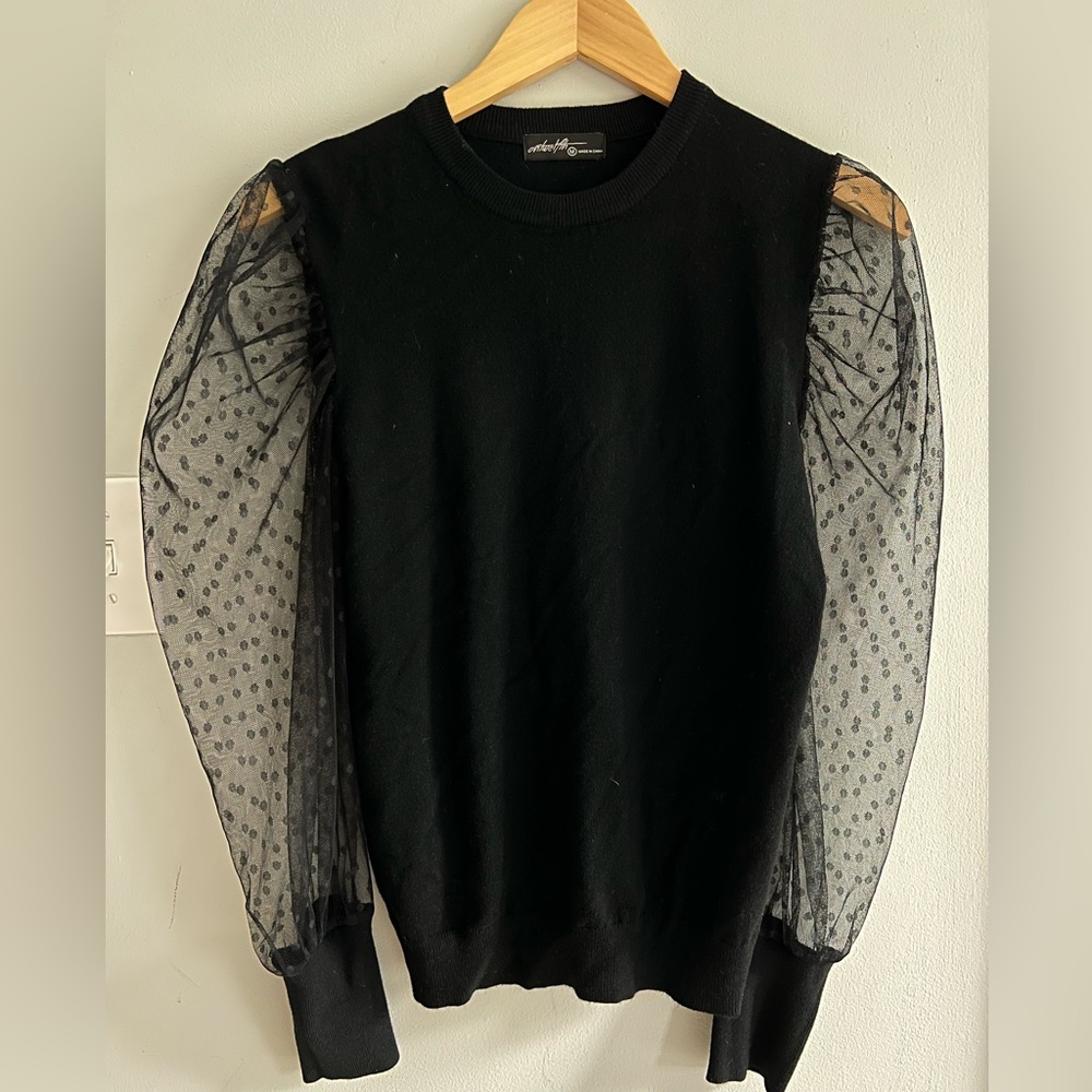 Black sweater with Swiss dot sheet sleeves